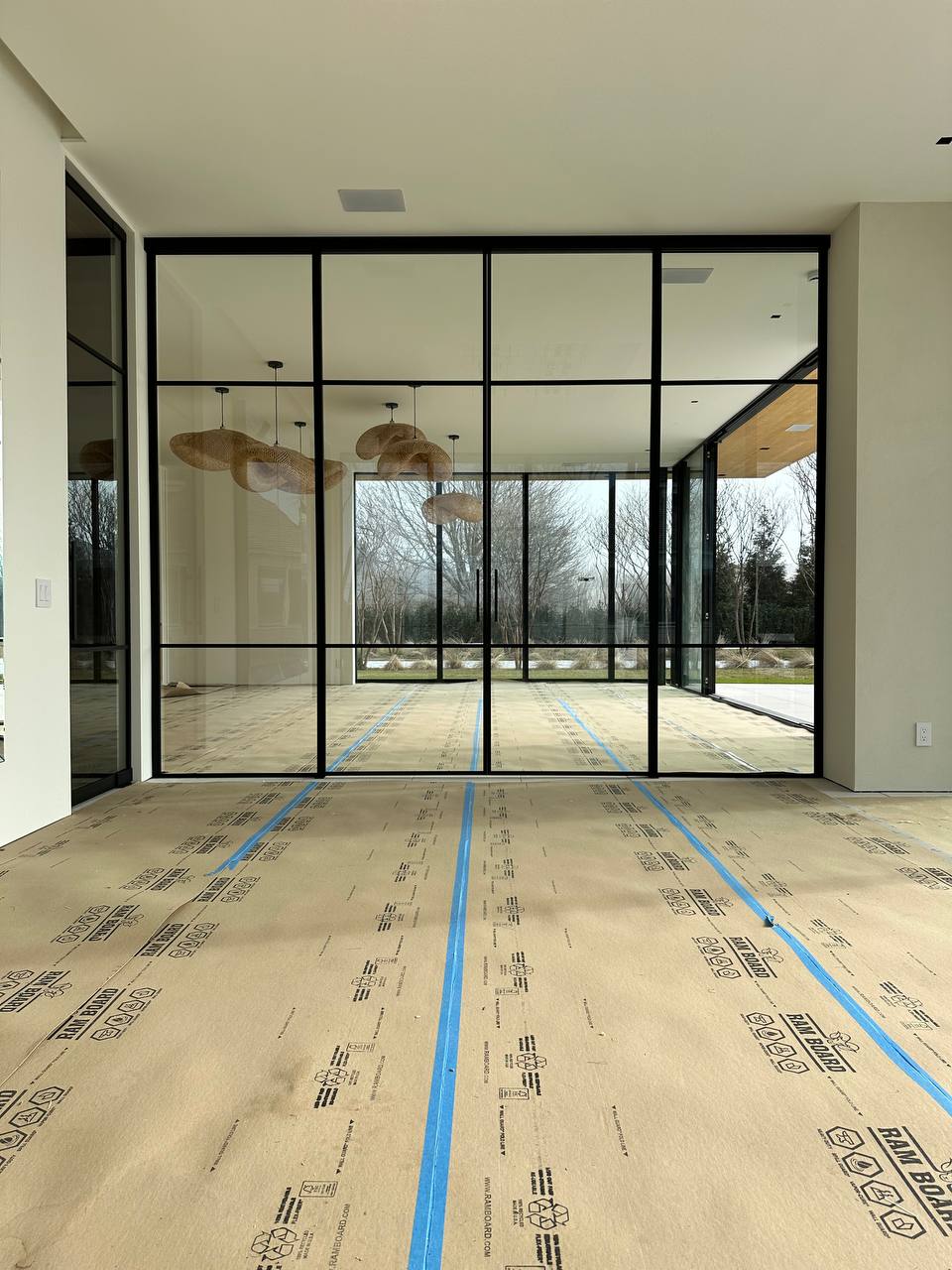 Double sliding glass partition at Water Mill NY estate by WiseGlass NY